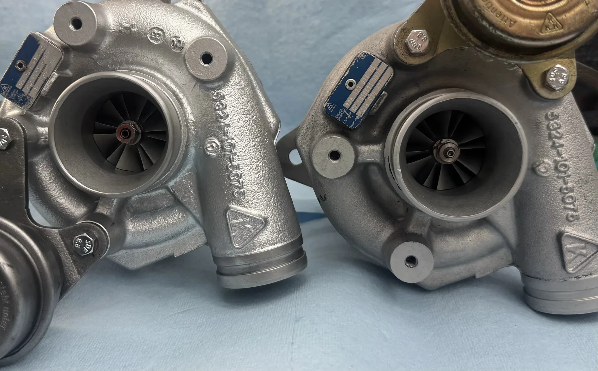 Porsche turbocharger pair prepared for identification and rebuild evaluation